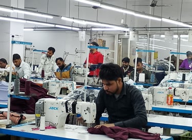 a group of people working on sewing machines