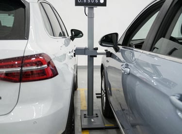 Close-up of a mechanic replacing brake pads on a car wheel.