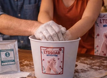 Couple creating a keepsake hand casting together using a DIY molding kit at home