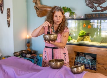 Zsofia performing sound healing on client