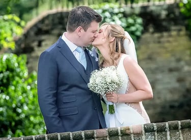 wedding couple sharing a kiss