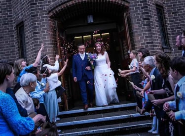 wedding couple leaving the church