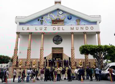 The exterior of La Luz Del Mundo church in Los Angeles during a crowded press conference.