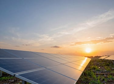 A solar panel installation on a Guatemalan rooftop under a bright blue sky.