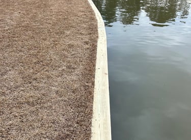 Ground contact pressure treated sea wall