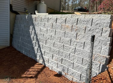 Retaining wall holding back soil. Block- Belguard Diamond Pro 8x8x16