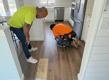 CP Prime Services professional cleaning team performing detailed floor maintenance and repair in a m