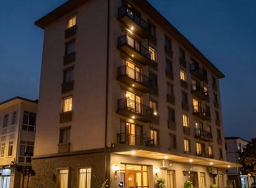 Luxurious hotel lobby bathed in warm light with elegant decor and welcoming atmosphere.