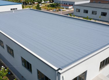 A large commercial building featuring a flat roof with professional roofing materials.