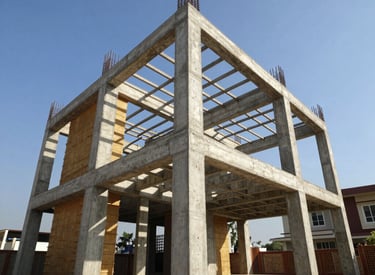 Low-angle heroic shot of active reinforced concrete framing at a premium Hyderabad villa community, bright daylight, sharp structural shadows, high-contrast.