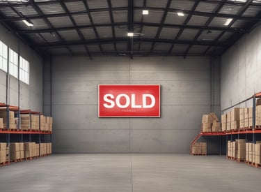 A sleek office building with glass windows reflecting the city skyline.