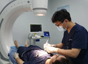 Technician carefully inspecting a c-arm in a hospital room.