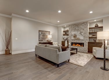 Newly finished basement in Mount Prospect, IL with luxury vinyl flooring, recessed lighting