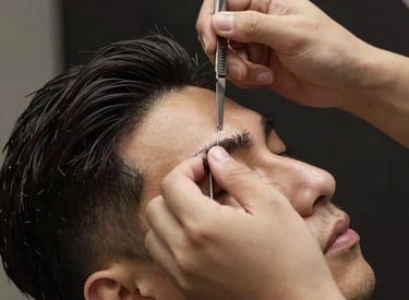 A stylish barber cutting a man's hair in a cozy home setting with modern decor.