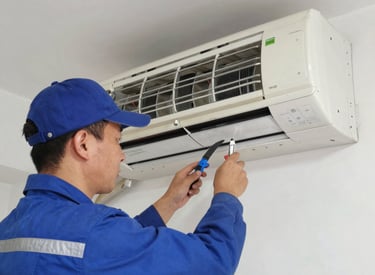Close-up of a technician fixing an air conditioning system outdoors on a sunny day.