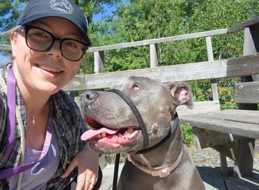 a woman with her dog on in north bay, ontario