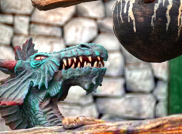 Immersive dragon-themed landmark with smoke effects designed for a themed dining and attraction zone