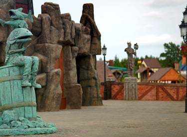 Landmark central plaza created with custom sculptures, immersive rockwork and themed world-building 