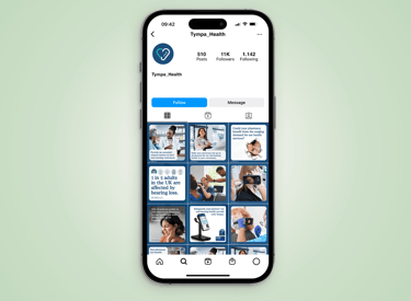 A phone displaying a photo of a person against a blue background.