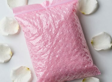 a single pink rose on a pink card