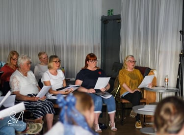 Choir members in rehearsal
