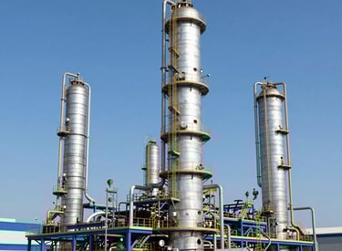 Wind turbines and solar panels integrated in an energy infrastructure site.