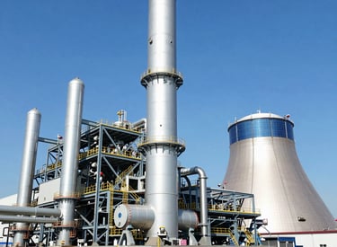 Wind turbines and solar panels integrated in an energy infrastructure site.