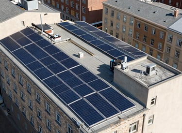 Community solar installation with multiple residential buildings.