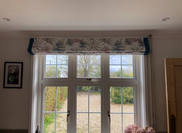 Bespoke roman blind with contrast borders.