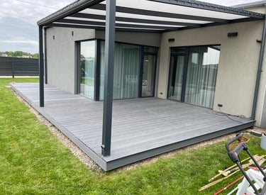 a patio with a deck and a lawn chair