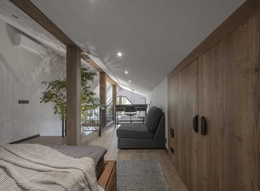 a bedroom with a bed and a couch