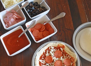 a pizza pie with pepperoni for build your own pizza catering parties