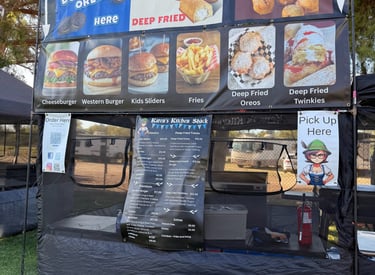 a food vendor tent with a menu on it