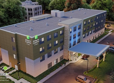 a hotel with a large building and a parking lot