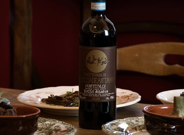 San Gemini, Il giardino - Vino e cucina - a bottle of wine on a table with a bottle of wine