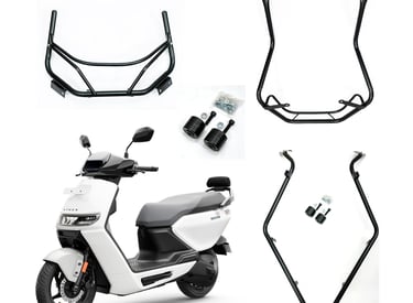 A white Ather electric scooter with various black guard and accessory components surrounding.