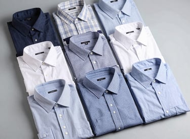 Stacks of neatly folded premium men's shirts ready for shipment in a clean warehouse.