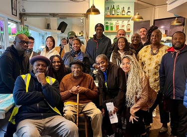 a group of people with Leslie Palmer