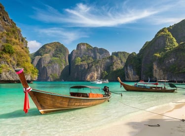 boats on the beach in thailand