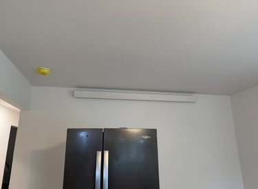 overhead heater above a refrigerator