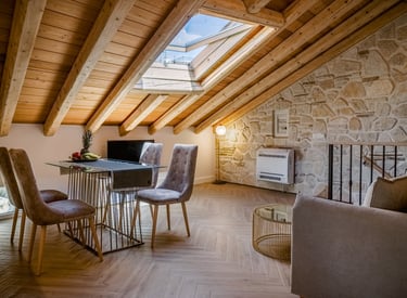 Sophisticated loft accommodation featuring wooden ceiling, natural stone architecture and comfort,