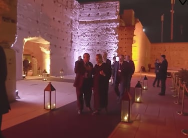 a group of people standing around a building