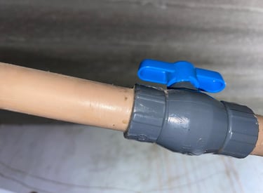 a pipe pipe with a blue plastic pipe and a blue pipe