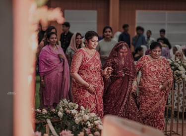 a bride and groomsmid are walking down the aisle