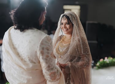 a man and woman in traditional indian wedding attire