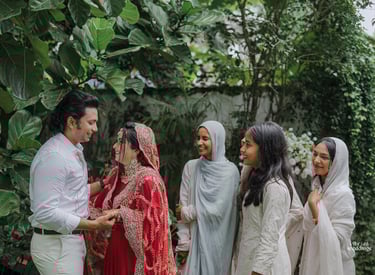 a man and woman in white and red indian wedding attire