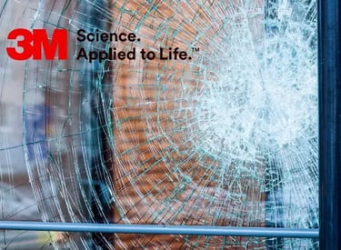 a smashed glass window with a smashed glass in the window