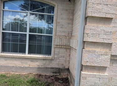 Hose Washing photo showing a window and brick after washing