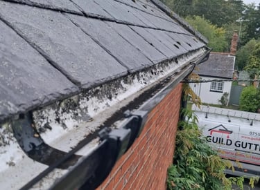 Gutter clearance and debris removal on residential property