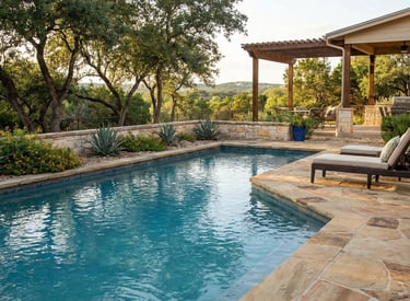 Backyard pool with clean water and stone coping.